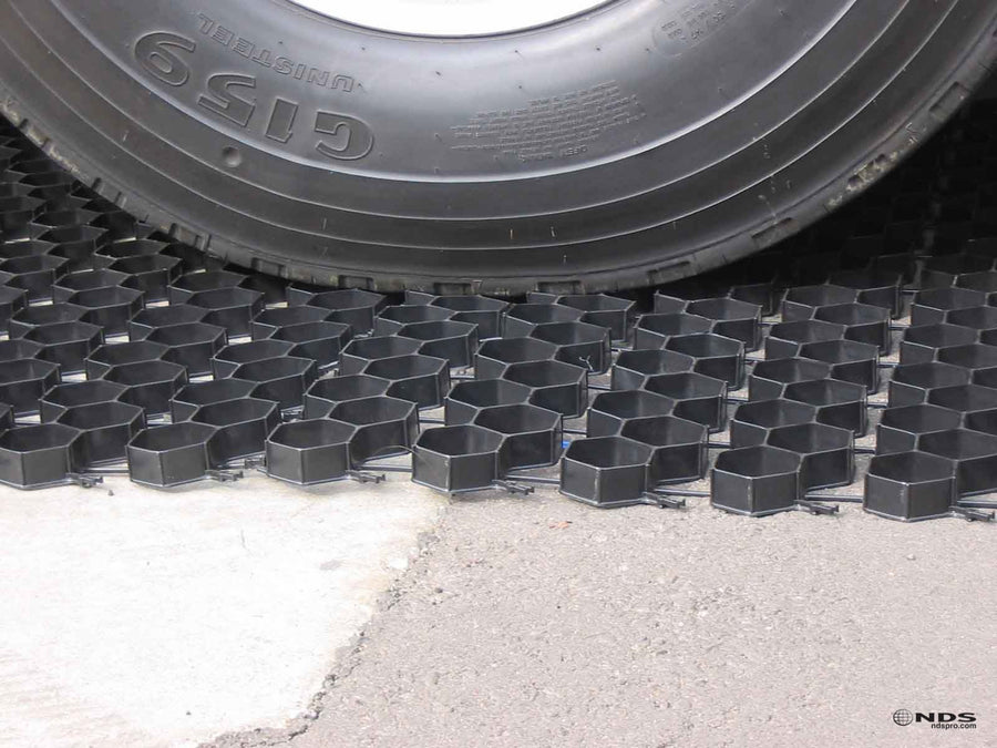 Truck tire driving on NDS EZ Roll grass paver cells